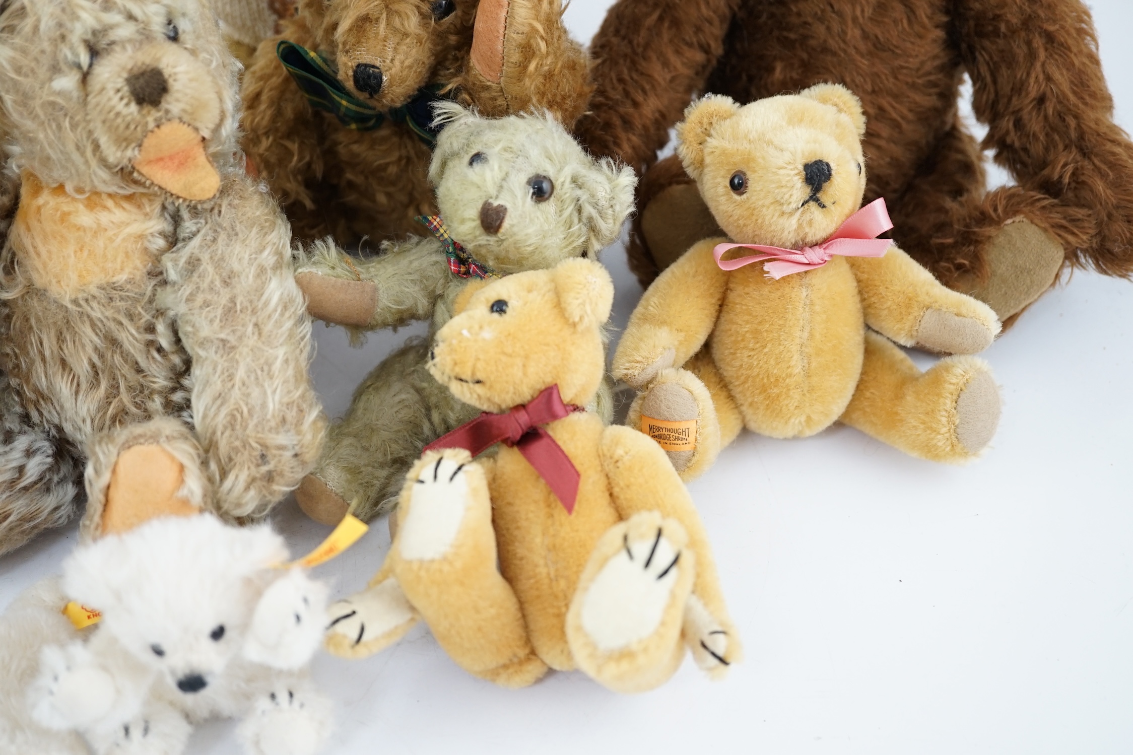 A collection of twenty-six modern teddy bears by The English Teddy Bear Co., Honey Hill Bears, Merrythought, Robin Rive, Steiff, etc.